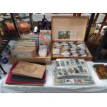 A good collection of cigarette cards in albums & loose tea cards etc.