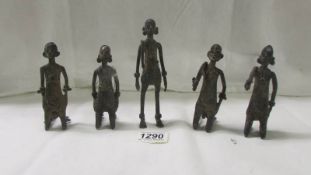 A group of five bronze African tribesmen, tallest 14 cm, age unknown.
