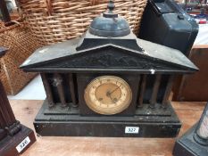 A black slate mantle clock with 6 brass reeded columns, no key, no pendulum, 1 spring broken 1