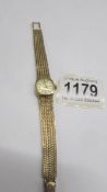 A ladies 9ct gold Omega wrist watch.