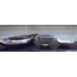 A large mottled glass bowl and two ceramic bowls.