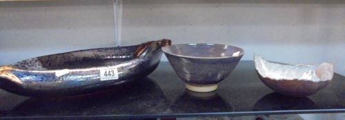 A large mottled glass bowl and two ceramic bowls.