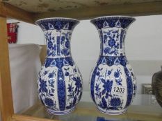 A pair of Italian Chinese style blue and white vases. 26 cm tall.