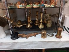 A good selection of brassware including candlesticks, ink well & plane ornaments etc.