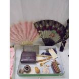 A mixed lot including 2 fans, cigarette case, miniature books etc.,