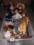 A quantity of porcelain faced dolls