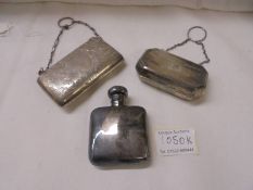 Two Victorian silver purses and a silver hip flask.