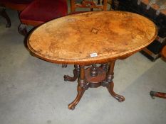 A small oval mahogany inlaid table with birdcage base. COLLECT ONLY.