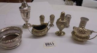 A mixed lot of silver plate condiments, sugar sifter, coaster etc.,