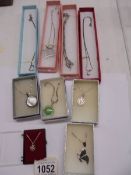 A mixed lot of silver necklaces and pendants.