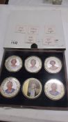 Six cased 'The Monarchy' coins, Silver Jubilee, Ruby Jubilee, Golden Jubilee, Two Sapphire Jubilee