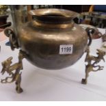 A large oriental brass pot on three Dragon feet.