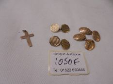 A pair of 9ct gold cuff links, 5.5 grams, a pair of 10ct gold cuff links, 8.8 grams and a 9ct cross.