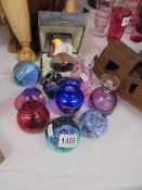 A Caithness paperweight, 5 other paperweights, 3 vases and a scent bottle.