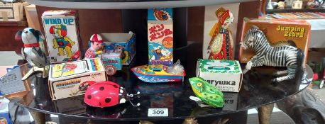 A selection of boxed Chinese & Russian tin plate clockwork toys