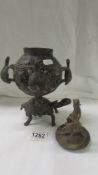 An African bronze lidded pot stood on a turtle, turtles round sides the lid with man on a turtle.