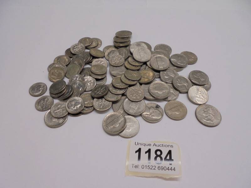 A quantity of USA 2 dime and 1 dime coins.
