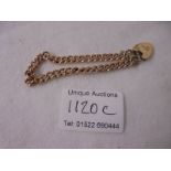 A 9ct gold bracelet with padlock and safety chain, 14 grams.