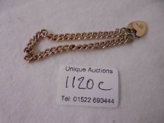 A 9ct gold bracelet with padlock and safety chain, 14 grams.