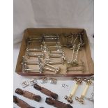 A mixed lot of silver plate knife rests and a set of six wooden examples.