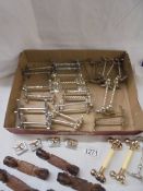 A mixed lot of silver plate knife rests and a set of six wooden examples.