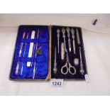 A silver handled manicure/needlework set.