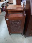 A 19th/20th century mahogany wall cupboard with art nouveau carved door