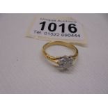 An 18ct yellow gold seven stone diamond ring, size L half, 2.6 grams.