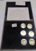 A cased set of WW1 centenary commemorative coins with certificate.