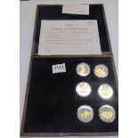 A cased set of WW1 centenary commemorative coins with certificate.