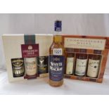 Two Connoisseur three bottle whisky sets and a bottle of Whyte and Mackay whisky.