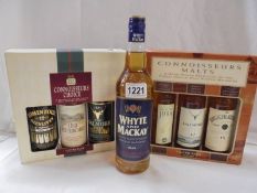 Two Connoisseur three bottle whisky sets and a bottle of Whyte and Mackay whisky.