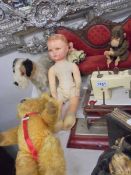 A vintage teddy bear, toy dog, doll's sofa, 2 toy sewing machines etc.,