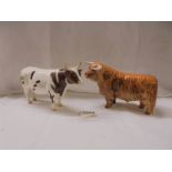 Two Beswick bulls.