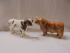 Two Beswick bulls.