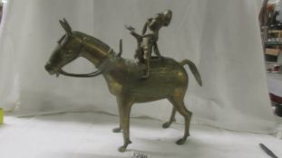 A bronze African warrior on a horse, 36 cm tall, age unknown.