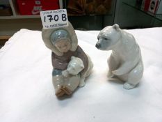 A Lladro Eskimo with polar bear cub & a polar bear