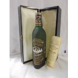 A boxed bottle of centenary Glenfiddich Scotch whisky.