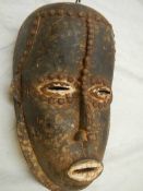 A Nigerian Ibiobio style mask, 30 x 20 cm.