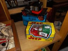 A boxed tin plate vintage style car & fire engine jeep