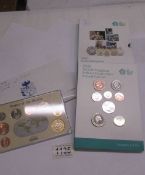 A UK uncirculated coin set and a 'Coins of the Realm, Falklands' coin set.