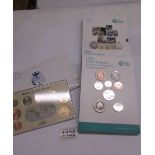 A UK uncirculated coin set and a 'Coins of the Realm, Falklands' coin set.