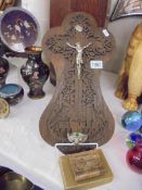 A crucifix on oak wall plaque, prayer book etc.,