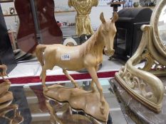 A carved wood horse statue. COLLECT ONLY.