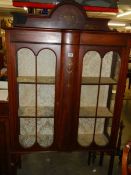 An Edwardian bow front cabinet. COLLECT ONLY.