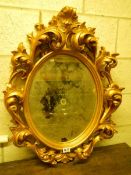 A heavy gilt framed circular mirror, COLLECT ONLY.