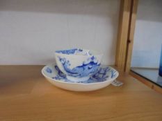 A Graingers of Worcester blue and white dragon decorated tea cup and saucer.