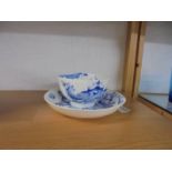 A Graingers of Worcester blue and white dragon decorated tea cup and saucer.