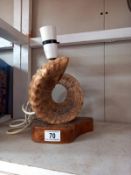 A vintage taxidermy mounted rams horn table lamp