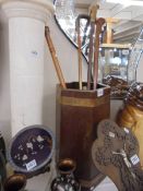 An oak stick stand and four walking sticks. COLLECT ONLY.